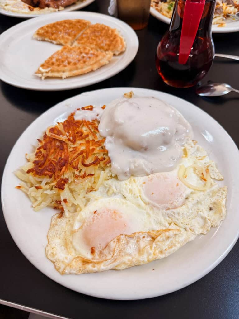 Biscuits and gravy with fried eggs and hash browns at the Red Hut, a classic South Lake Tahoe breakfast restaurant
