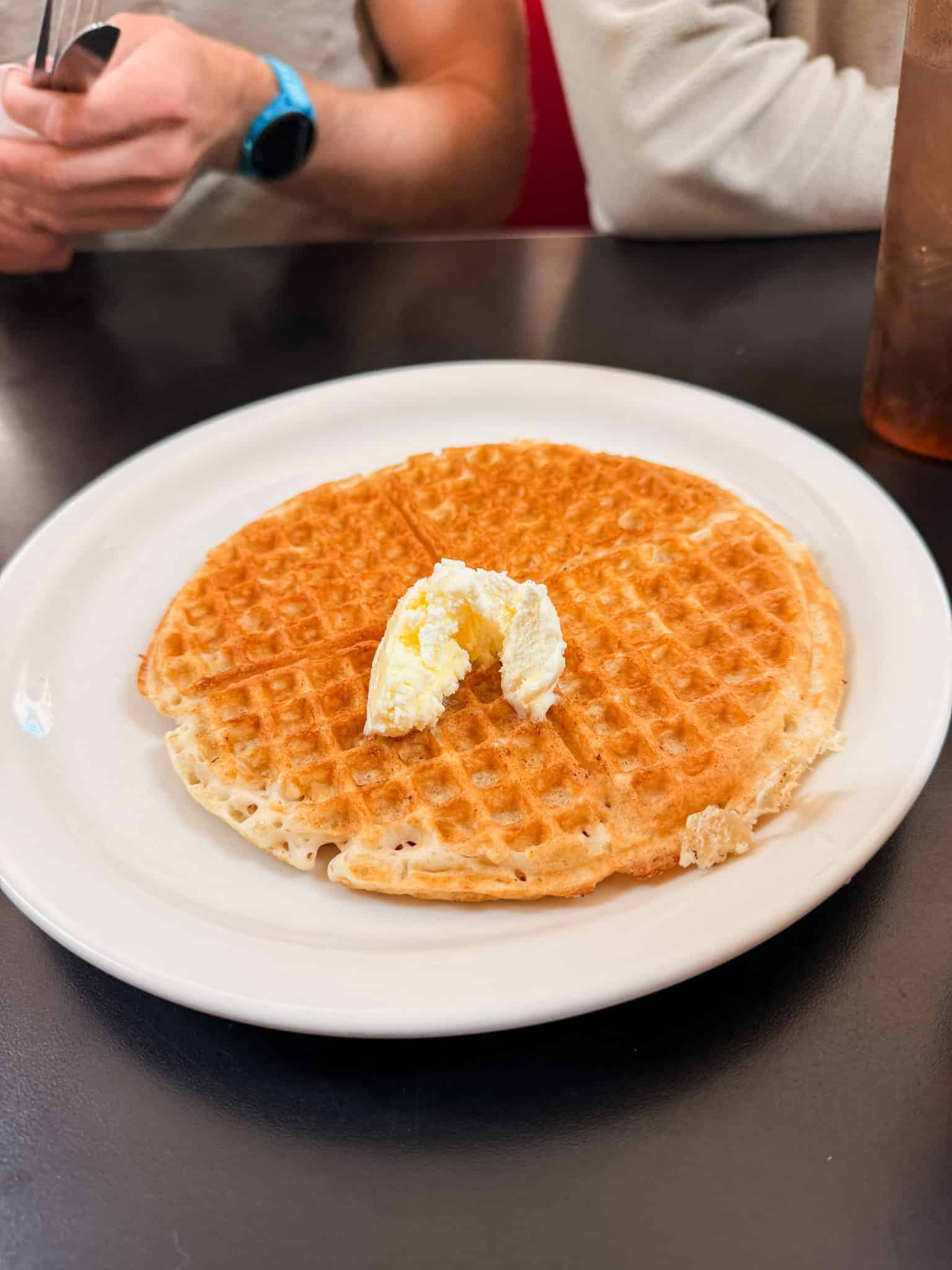 Golden crispy waffle with butter at the Red Hut Cafe, a popular South Lake Tahoe breakfast spot