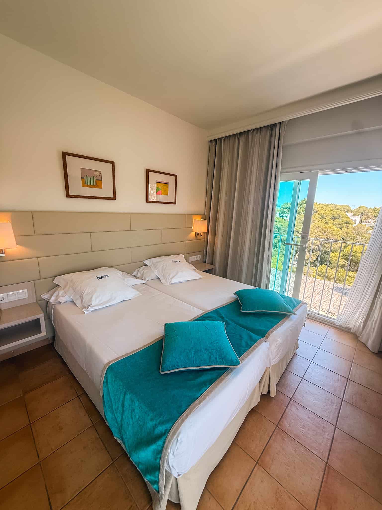 Bright hotel room overlooking a peaceful cove in Cala d'Or, Mallorca