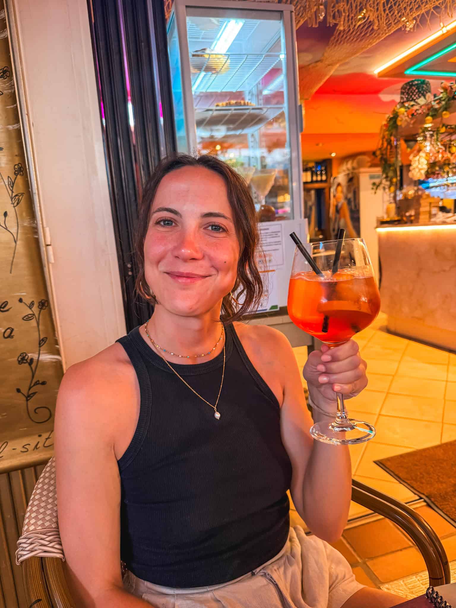 Aperol Spritz at a waterfront restaurant in Port de Sóller at sunset