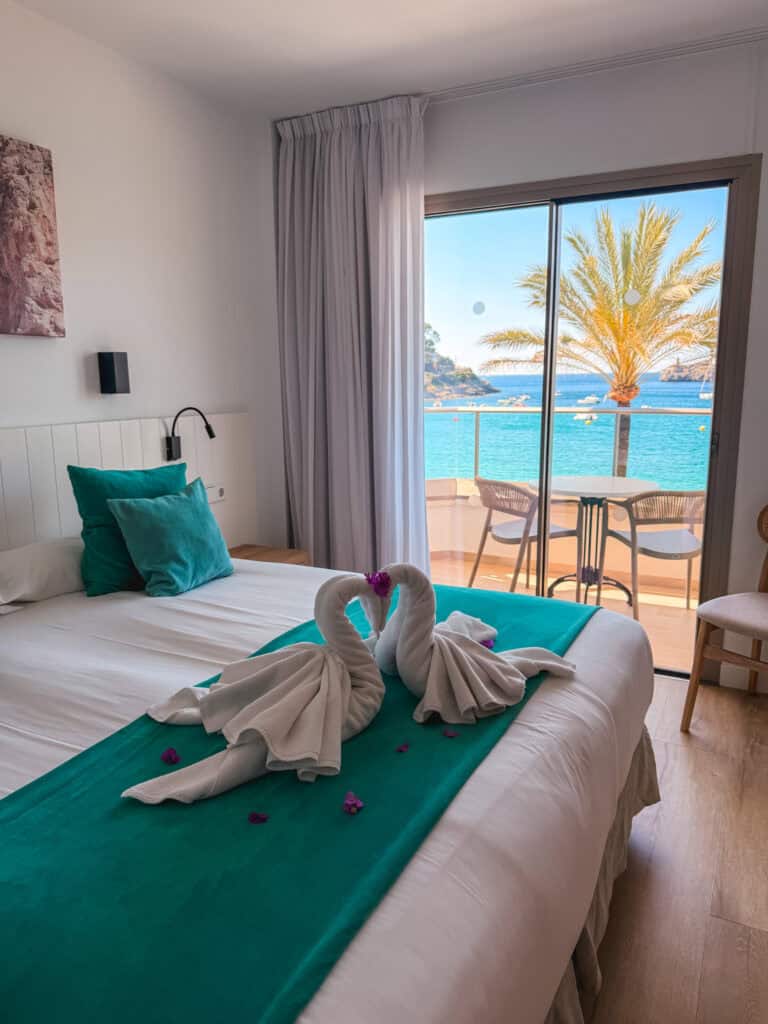 Oceanfront hotel room with balcony overlooking Cala d'Or, Mallorca