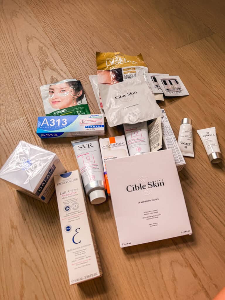 Flat lay of a French pharmacy products haul including Embryolisse, SVR, La Roche-Posay, Cible Skin, Orlane, and A313