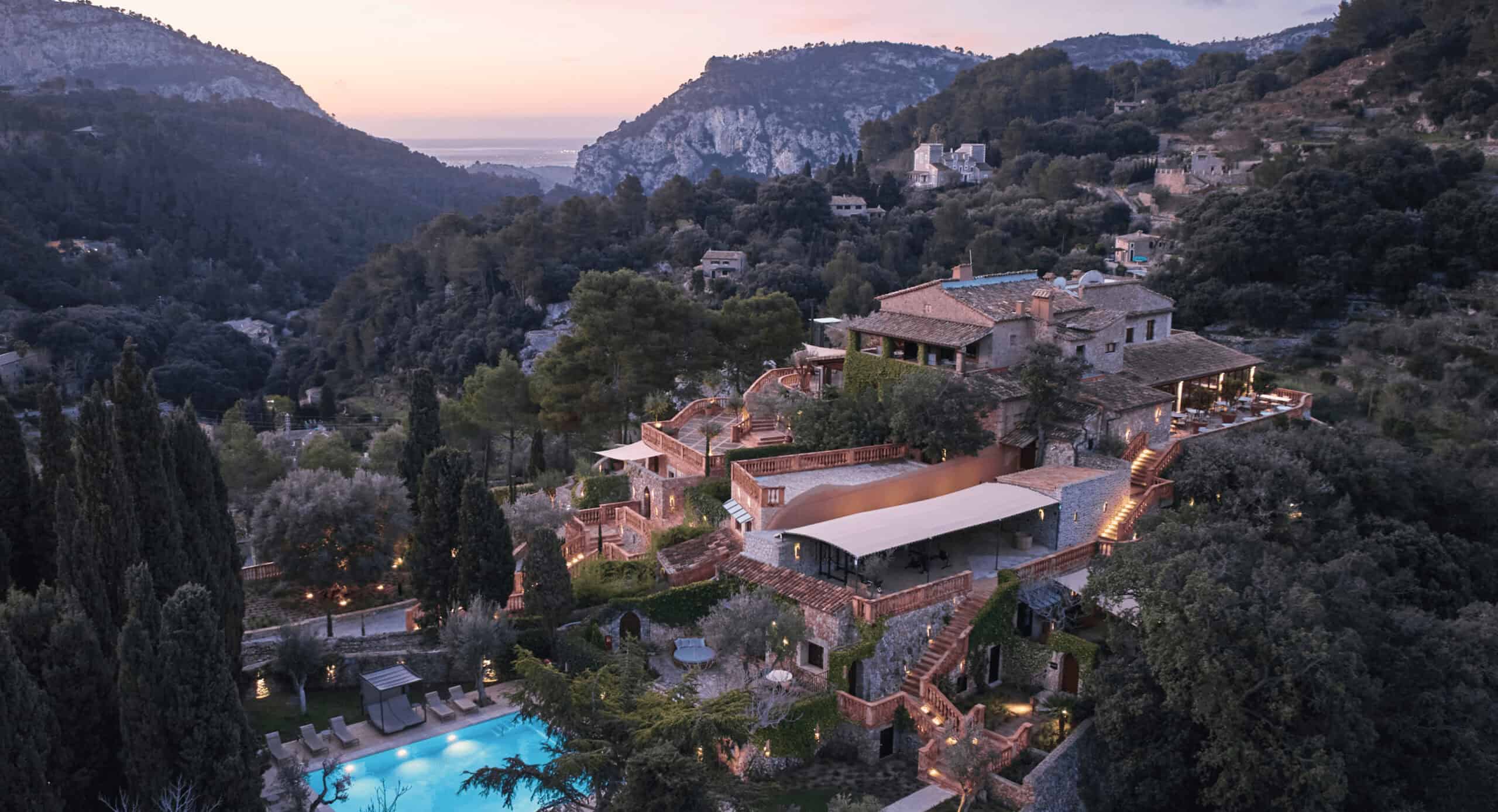 Stone rooftops and cypress trees in the hillside village of Valldemossa, Mallorca