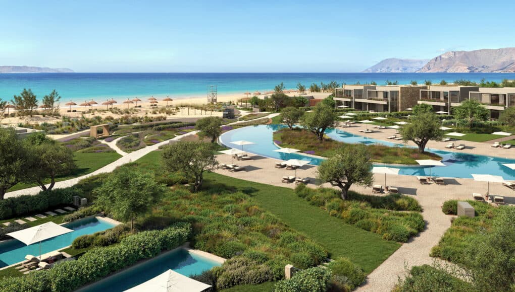 Aerial view of pools, gardens and beach at Ikos Porto Petro, an all inclusive resort in Mallorca