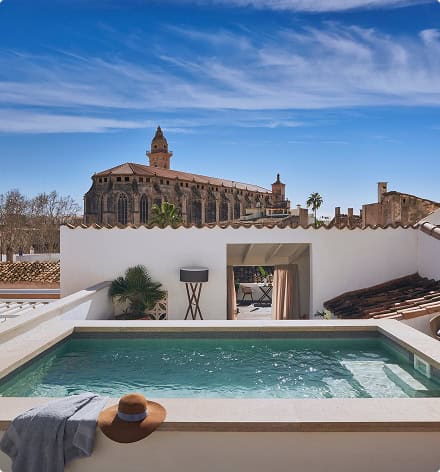 Rooftop plunge pool with cathedral views at a boutique hotel in Palma's old town, Mallorca